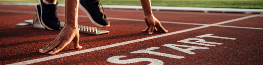 person starting their race at the starting line