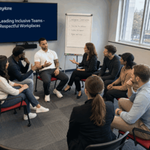 ash (facilitator) sitting discussing in a group - all sitting in a circle